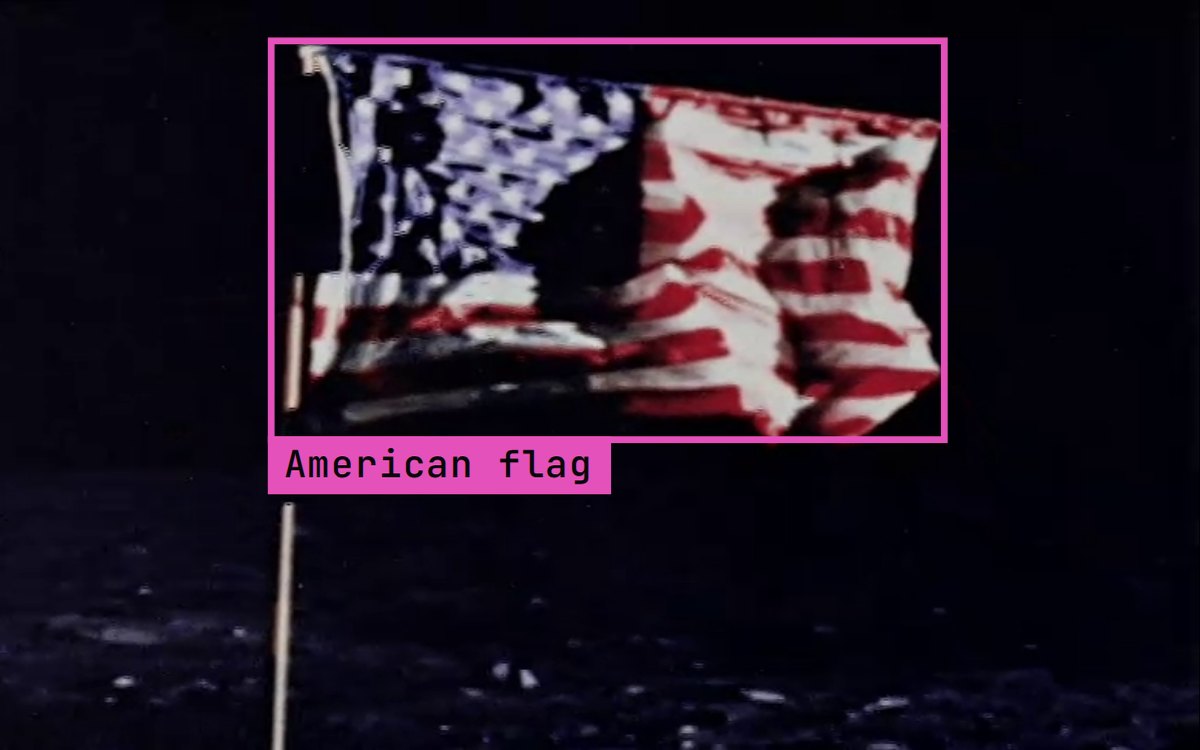 The US flag on the Moon in NASA's Apollo 11 film, with Jev's box from the run: American flag.